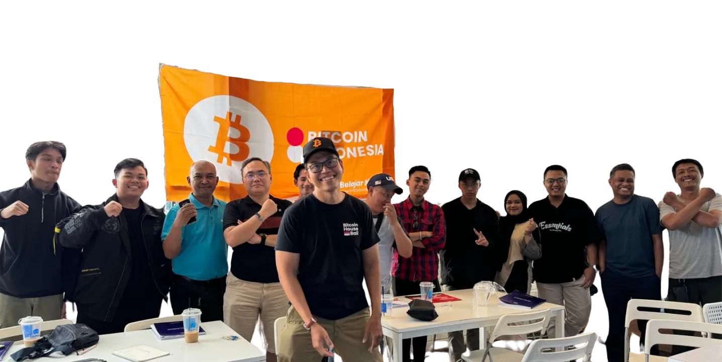 My First Bitcoin Indonesia cohort group photo in front of a Bitcoin Indonesia banner