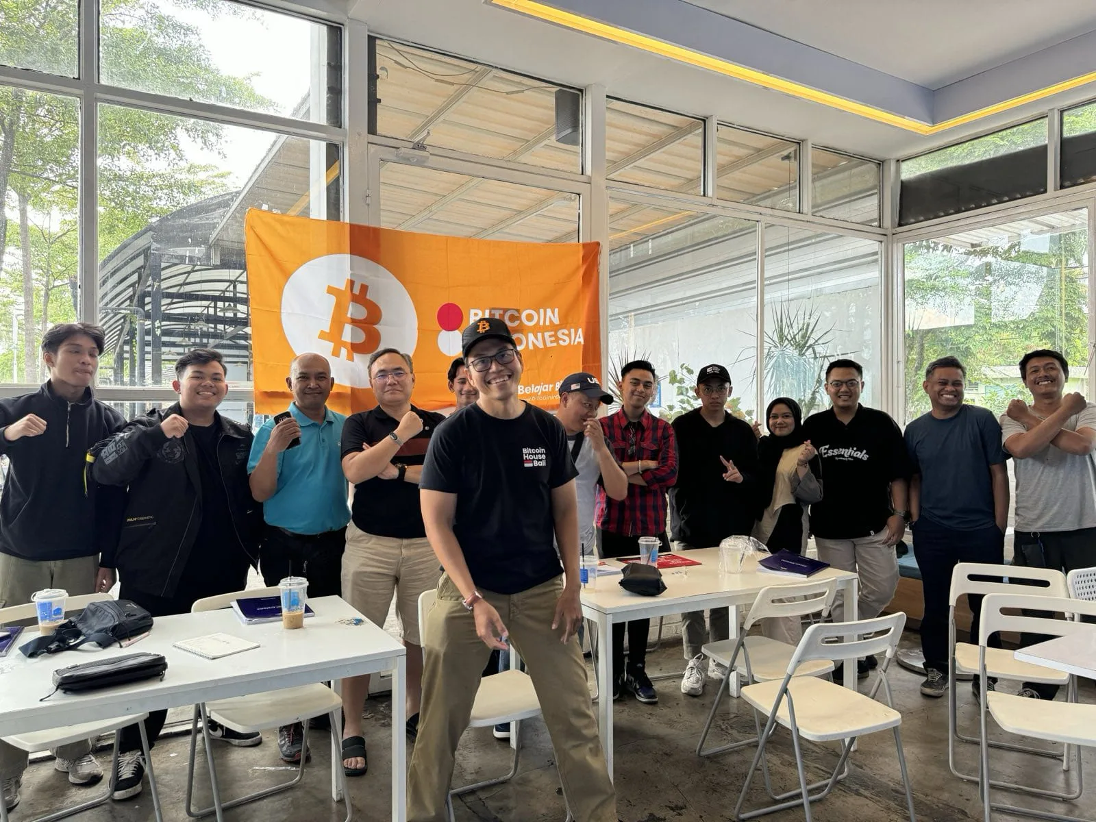 My First Bitcoin Indonesia cohort group photo indoors with a Bitcoin Indonesia banner