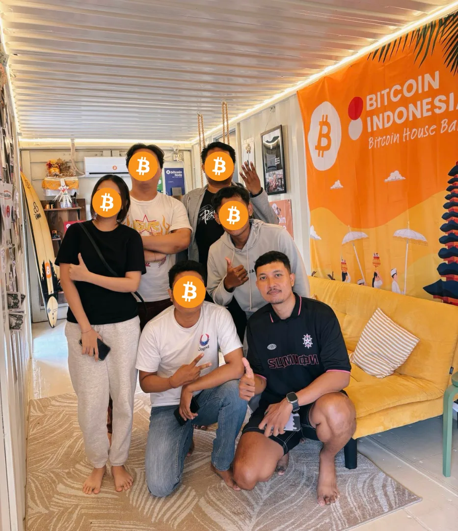 My First Bitcoin Indonesia cohort group photo at Bitcoin House Bali, faces covered with Bitcoin logos for privacy
