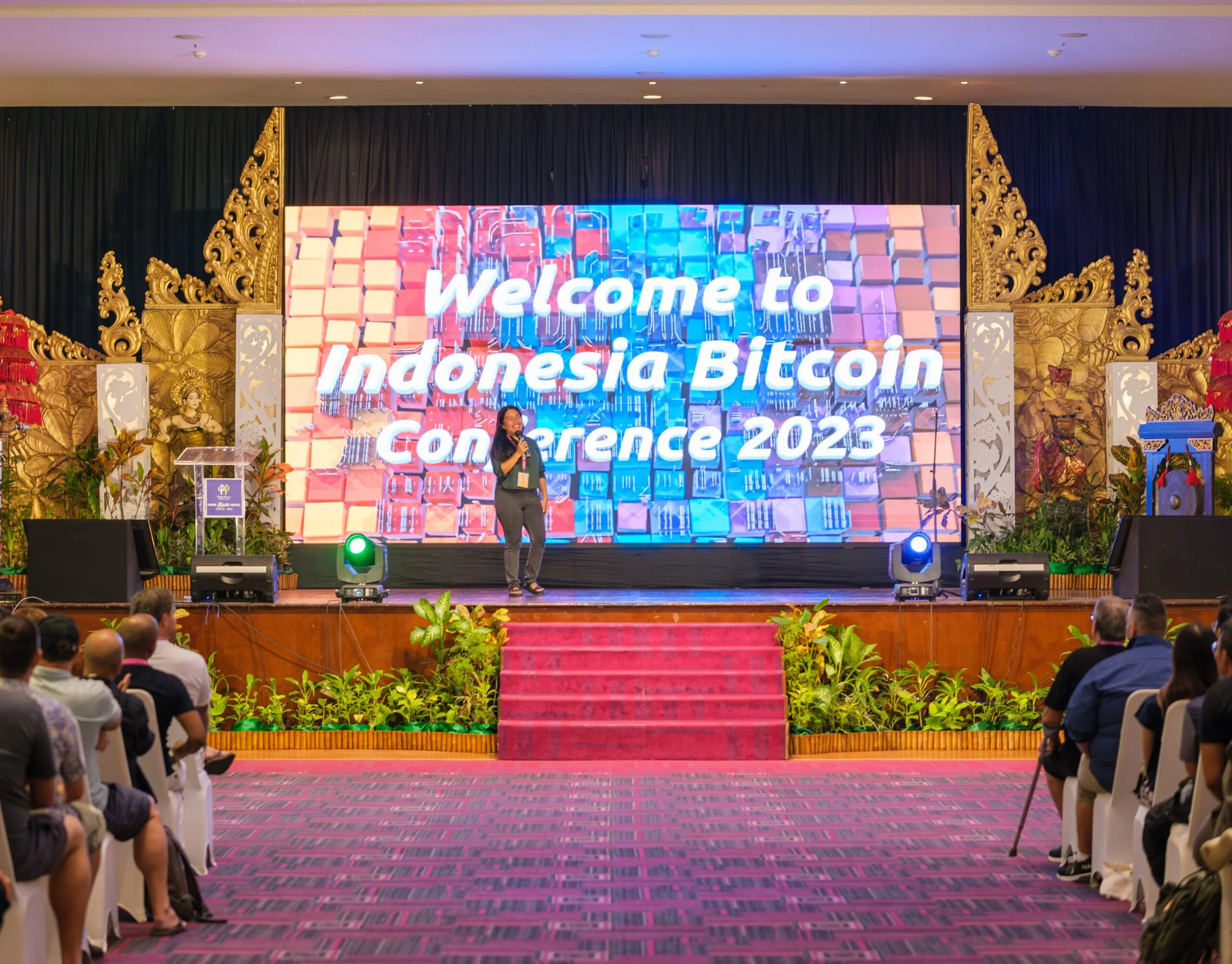 A speaker presenting on stage at the Welcome to Indonesia Bitcoin Conference 2023 opening
